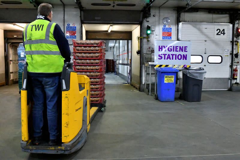 Marks & Spencer produce being loaded into freight dispatch via bladed fork lift at Gist logistics depot