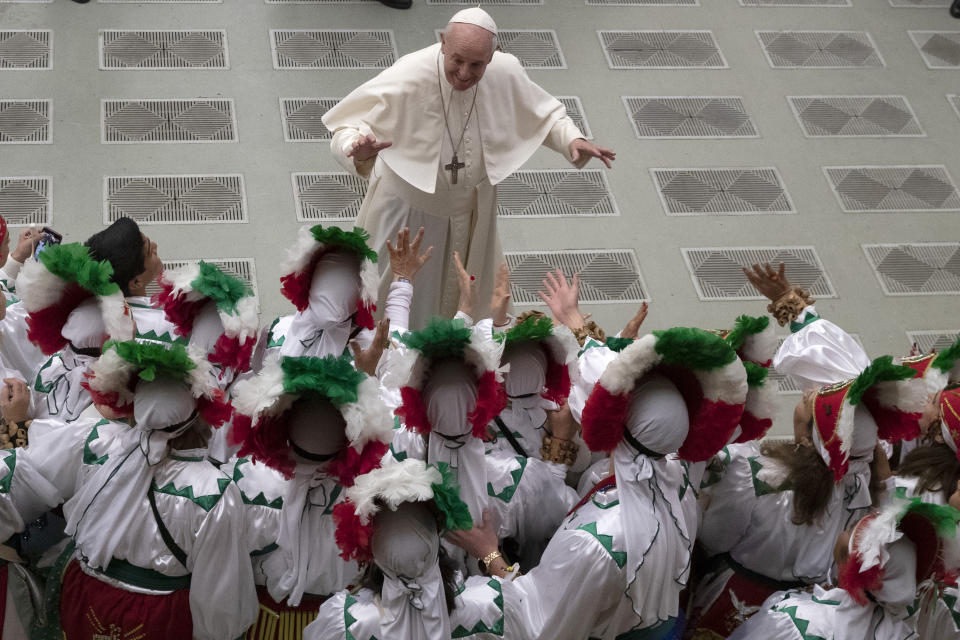 Pope Francis greets a group of Mexican pilgrims in the Paul VI Hall at the Vatican during his weekly general audience, Wednesday, Dec. 11, 2019. (AP Photo/Alessandra Tarantino)