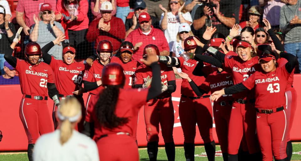 Oklahoma players celebrate a Cydney Sanders home run during a March 12 win over Tarleton State. The top-ranked Sooners will play a three-game series at No. 5 Texas starting Friday.