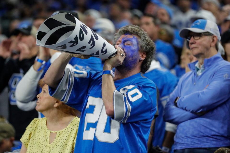 Detroit Lions fans cheer for the Detroit Lions against Los Angeles Rams during the first half of the NFC wild-card game at Ford Field in Detroit on Sunday, Jan. 14, 2024.