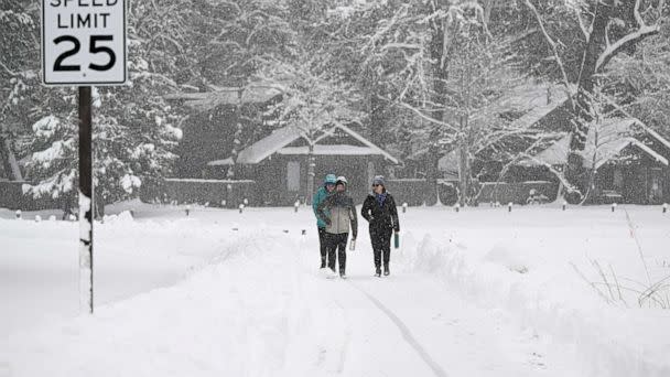 PHOTO: People are seen as snow blankets Yosemite National Park in California, United States on Feb. 23, 2023 as winter storm alerted in California. (Tayfun Coskun/Anadolu Agency via Getty Images)