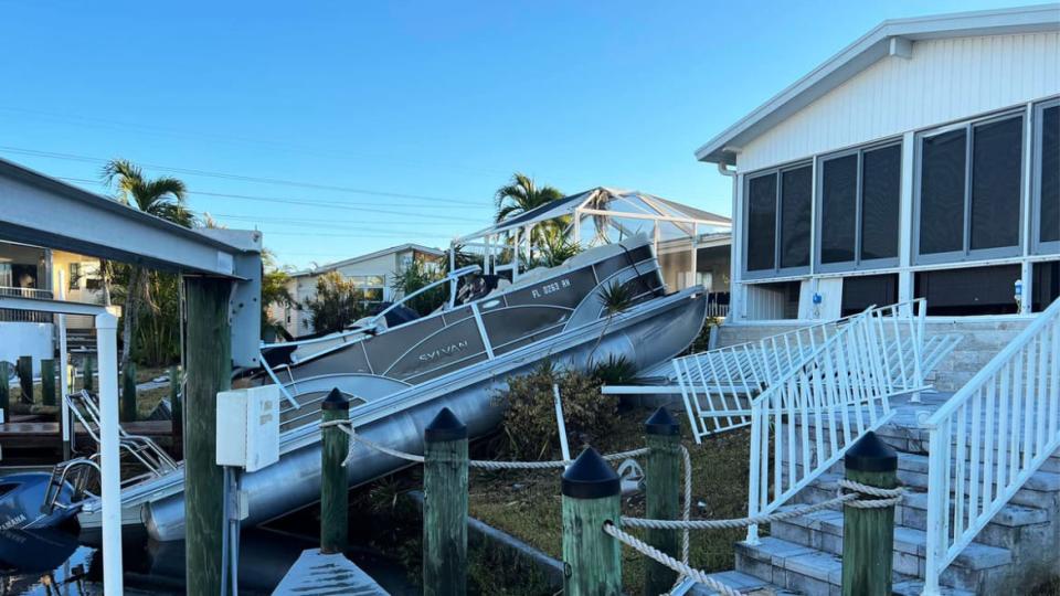 <div class="inline-image__caption"><p>A boat on top of a mobile home in Bayside Estates</p></div> <div class="inline-image__credit">Lauren Trahan</div>