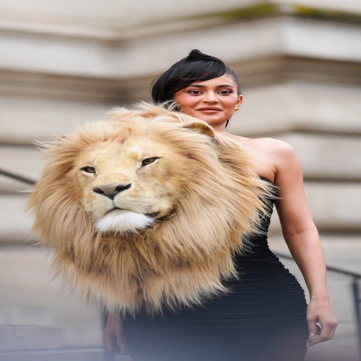 Kylie Jenner wears a lion head for Paris Fashion Week