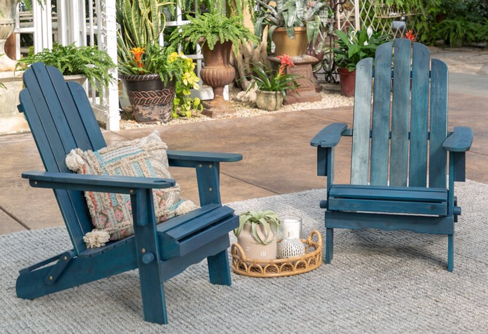 Classic Adirondack chairs in weathered navy will give your yard the perfect pop of color. (Photo: All Modern)