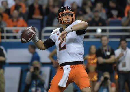 Dec 29, 2016; San Antonio, TX, USA; Oklahoma State Cowboys quarterback Mason Rudolph (2) throws a pass in the first quarter against the Colorado Buffaloes during the 2016 Alamo Bowl at Alamodome. Kirby Lee-USA TODAY Sports