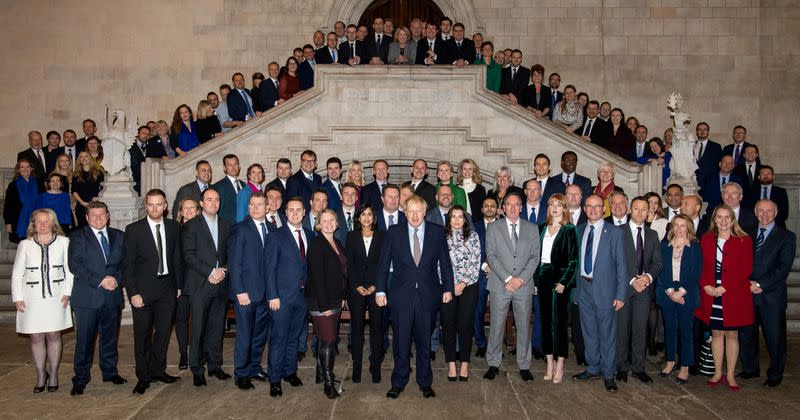 British Prime Minister Boris Johnson poses with newly-elected Conservative MPs at the Houses of Parliament in London