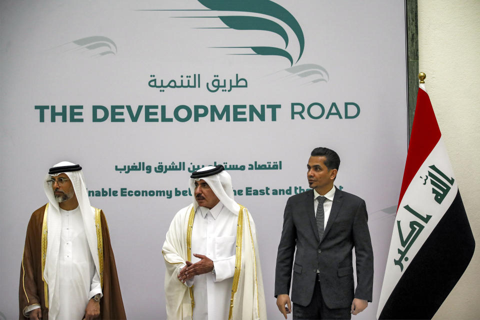 From left, UAE's Energy Minister Suhail Mohamed al-Mazrouei, Qatar's Minister of Transport Jassim bin Saif bin Ahmed al-Sulaiti, and Iraq's Transport Minister Razzaq Muhaibas al-Saadawi pose for a picture during their meeting for the signing of the "Development Road" framework agreement on security, economy, and development in Baghdad, Iraq, Monday April 22, 2024. (Ahmad Al-Rubaye/Pool via AP)