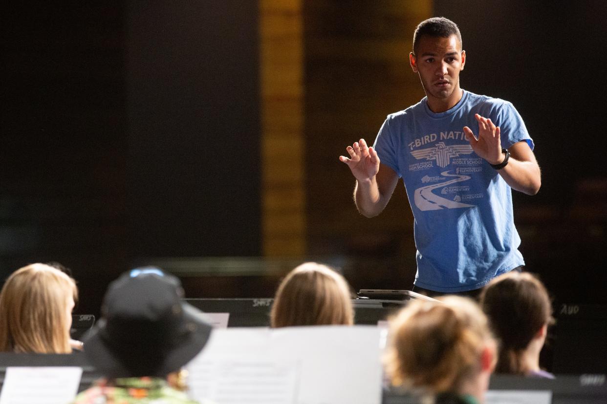 Ty'Rese Mendez conducts the summer band camp students at Shawnee Heights High School in early June. A recent music education graduate at Washburn University, Mendez said, "This is my first opportunity to do what I want and get paid for it."