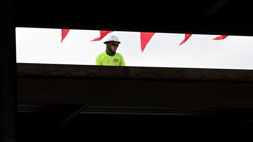 Construction workers paused as House Speaker Mike Johnson, R-La., toured the construction site for the $70 million ground-level passenger terminal at Sarasota Bradenton International Airport.