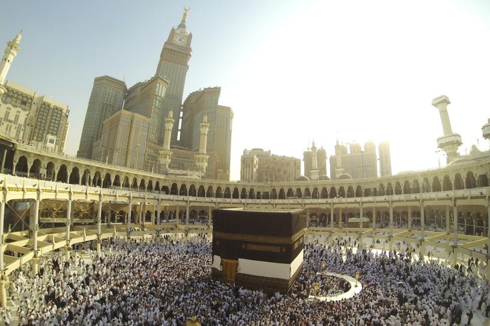 Muslim people praying at Kaaba in Mecca: Shutterstock