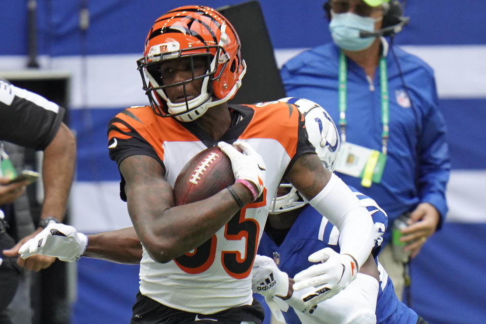 Cincinnati Bengals' Tee Higgins (85) is tackled by Indianapolis Colts' Rock Ya-Sin (26) during the first half of an NFL football game, Sunday, Oct. 18, 2020, in Indianapolis. (AP Photo/AJ Mast)