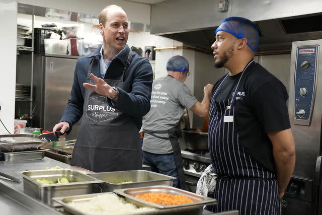 <p>Alastair Grant-WPA Pool/Getty Images</p> Prince William in the kitchen during a visit to Surplus to Supper, in Sunbury-on-Thames on April 18, 2024.
