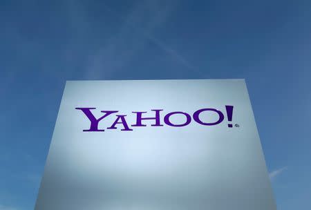 A Yahoo logo is pictured in front of a building in Rolle, 30 km (19 miles) east of Geneva, in this file picture taken December 12, 2012. REUTERS/Denis Balibouse
