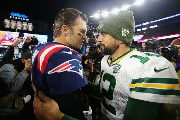 Tom Brady #12 of the New England Patriots talks with Aaron Rodgers #12 of the Green Bay Packers after the Patriots defeated the Packers 31-17 at Gillette Stadium on November 4, 2018 in Foxborough, Massachusetts.  (Photo by Maddie Meyer/Getty Images)