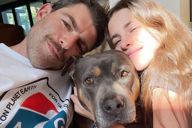 <p>Max Greenfield/Instagram</p> Max Greenfield and his wife, Tess Sanchez, pose with their dog Darlene in July 2023.