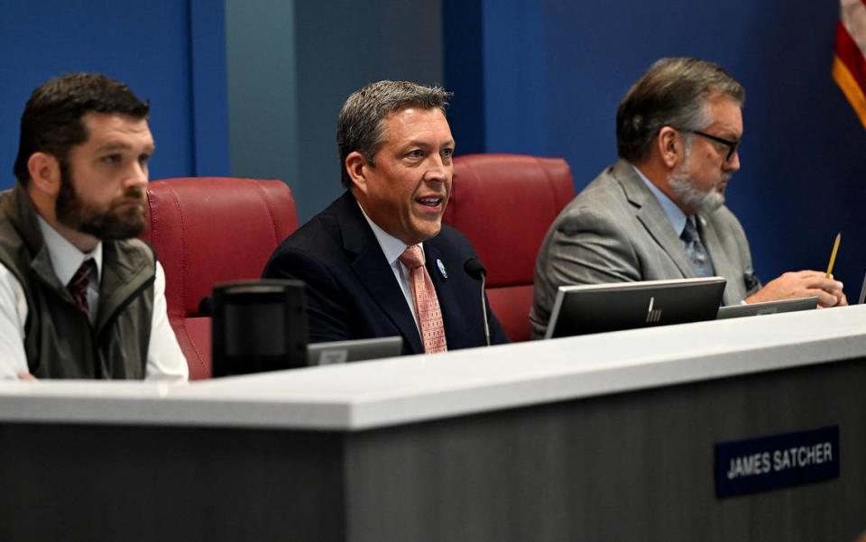 Commissioner George Kruse sits between Commissioners James Satcher (left) and Mike Rahn (right) during a Board of County Commissioners meeting on Thursday, Oct. 5, 2023.