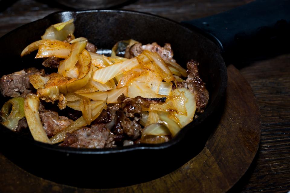 Sirloin steak with grilled onions prepared for tacos at the newly remodeled Great American Steakhouse in Northeast El Paso on Tuesday, Jan. 9, 2024. The restaurant recently reopened right before the new year.