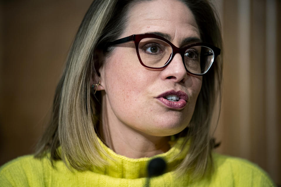 FILE - Sen. Kyrsten Sinema, D-Ariz., speaks during a Senate Homeland Security and Governmental Affairs Committee hearing on Feb. 1, 2022 in Washington. “This is a crisis, and in my estimation, because of a lack of planning from the administration, it’s about to get worse,” said Sen. Mark Kelly of Arizona. Kelly and fellow Arizona Democratic Sen. Sinema met Wednesday, March 30, with Homeland Security Secretary Alejandro Mayorkas to press their case for the administration to better plan and coordinate a response. (Al Drago/Bloomberg via AP, File)