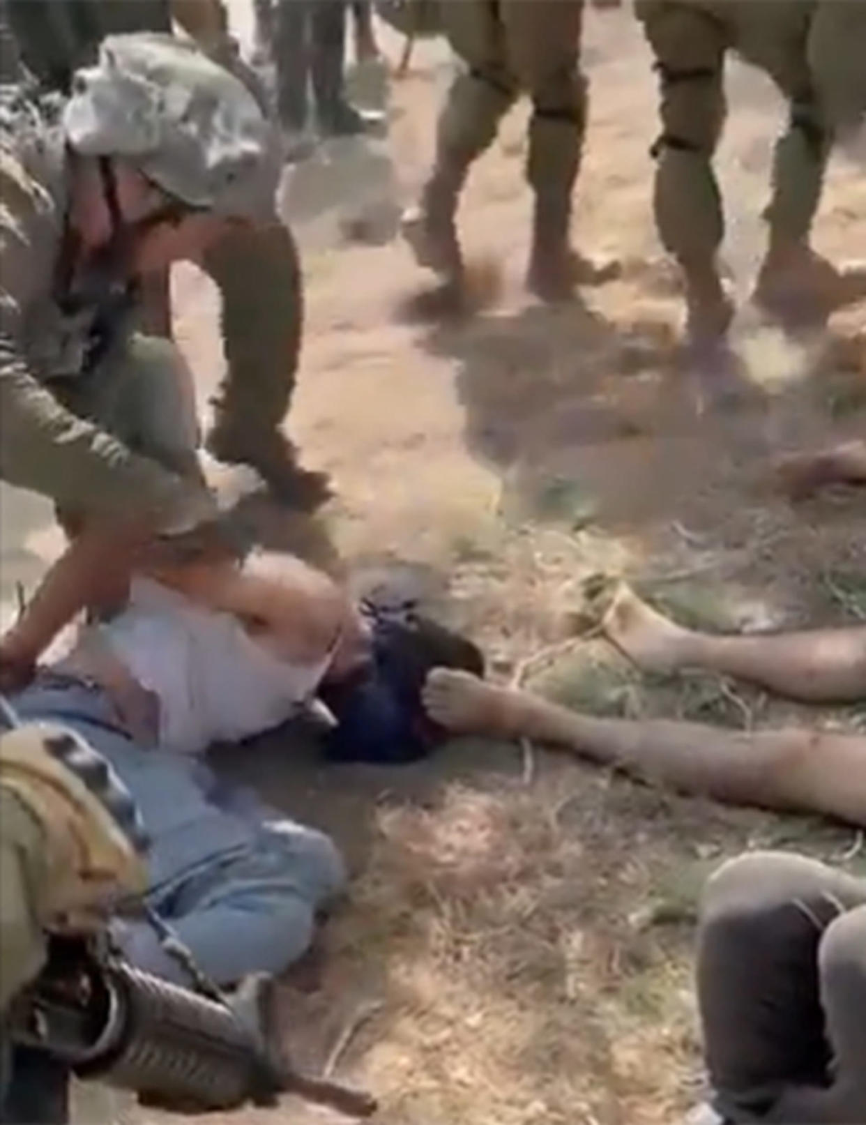 A video appears to show IDF soldiers with detained Palestinians in the West Bank. (via @RamAbdu / X)