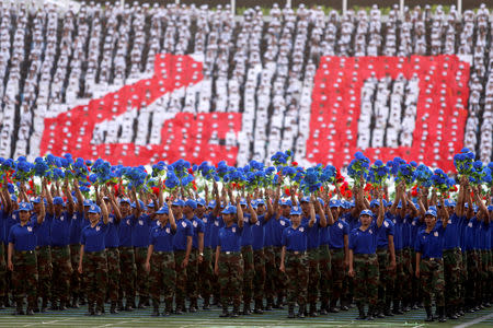 Cambodian soldiers attend an event to mark the 40th anniversary of the toppling of Pol Pot's Khmer Rouge regime at the Olympic stadium in Phnom Penh, Cambodia, January 7, 2019. REUTERS/Samrang Pring