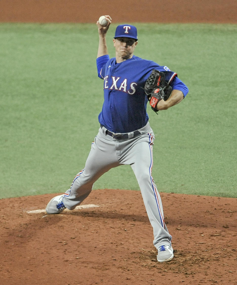 Texas Rangers starter Kyle Gibson pitches against the Tampa Bay Rays during the fourth inning of a baseball game Tuesday, April 13, 2021, in St. Petersburg, Fla. (AP Photo/Steve Nesius)