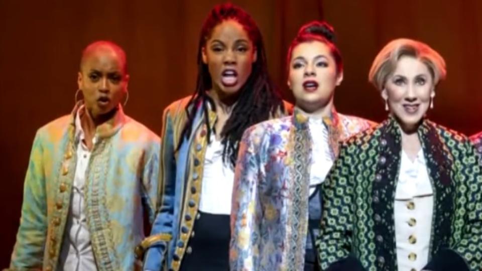 “1776” revival actress Zuri Washington (second from left) is suing the Broadway tour, alleging racial discrimination and retaliation after she requested to wear a wig on stage. (Photo: Screenshot/YouTube.com/CBS Colorado)