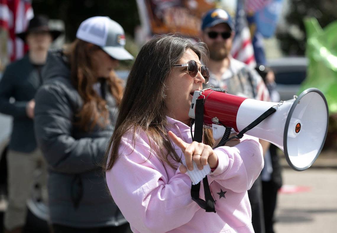 Michele Morrow works to unify more than 100 activists who gathered to protest a variety of topics across the street from The Executive Mansion in Raleigh on March 20, 2021.