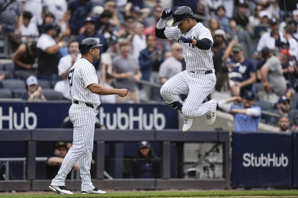 New York Yankees' Juan Soto, right, celebrates with third base coach Luis Rojas as he runs the bases after hitting a home run during the fifth inning of a baseball game against the Chicago White Sox, Saturday, May 18, 2024, in New York. (AP Photo/Frank Franklin II)