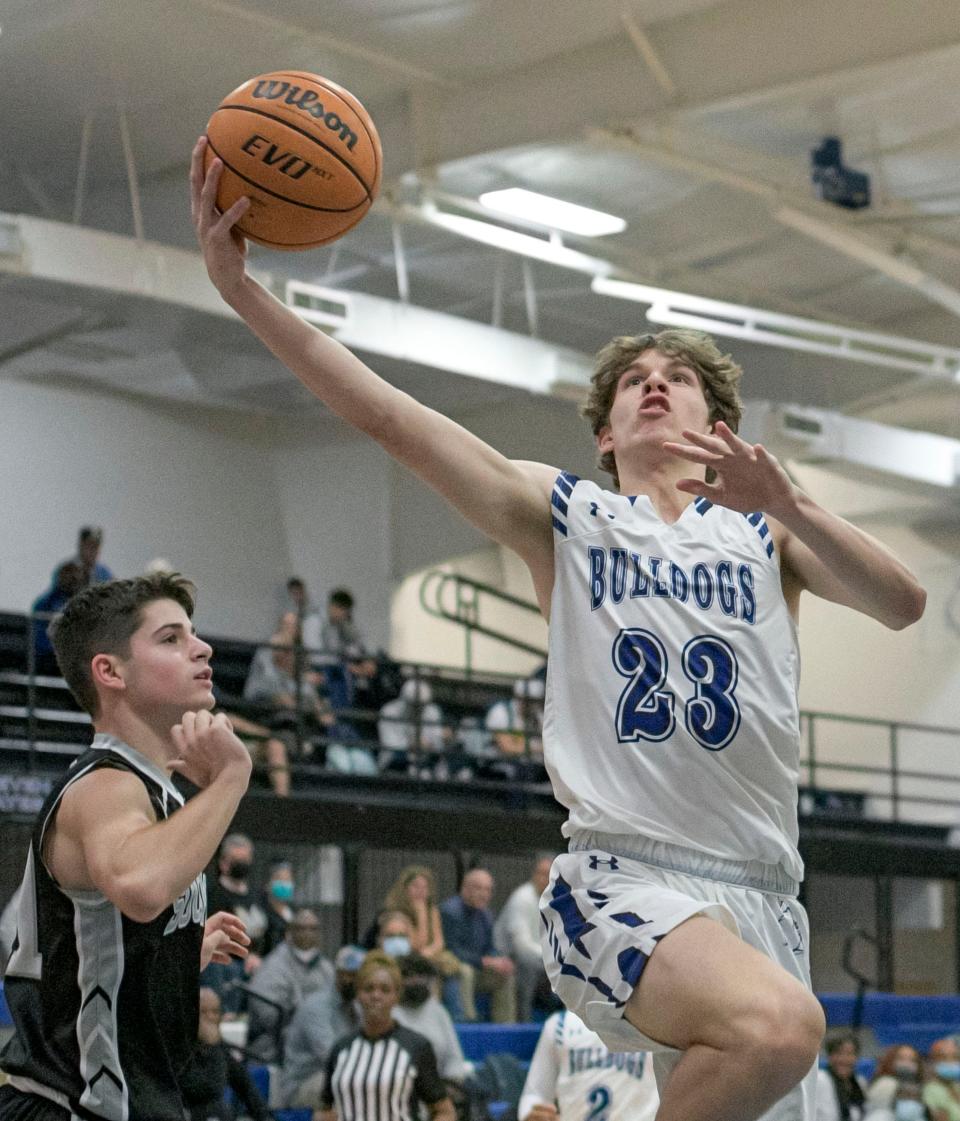 Mount Dora Christian Academy's Kevin Frederick (23) goes for a basket during Friday's game against South Lake High School in Mount Dora. He finished with 20 points, including four 3-pointers.