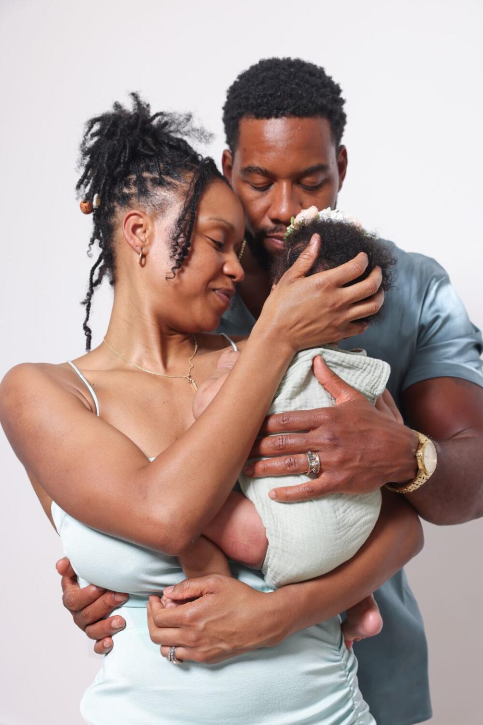 Michelle Mitchenor and Mustafa Speaks with their baby