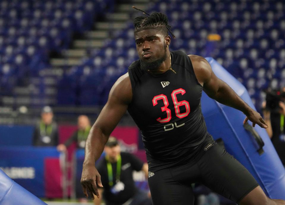 Michigan defensive lineman David Ojabo goes through drills during the NFL scouting combine at Lucas Oil Stadium.