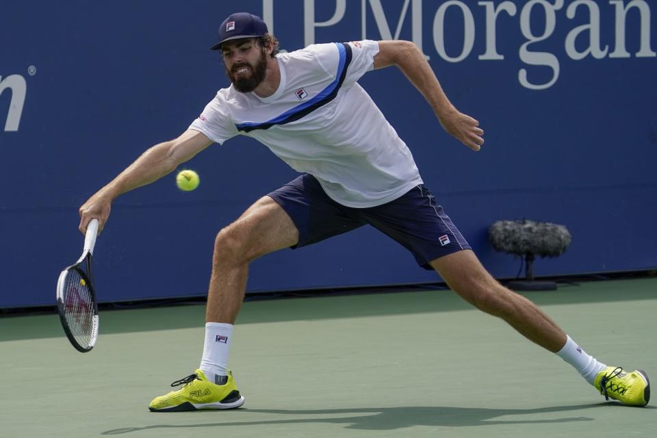 Reilly Opelka returns a shot during his match against Soonwoo Kwon at the U.S. Open on Aug. 31.