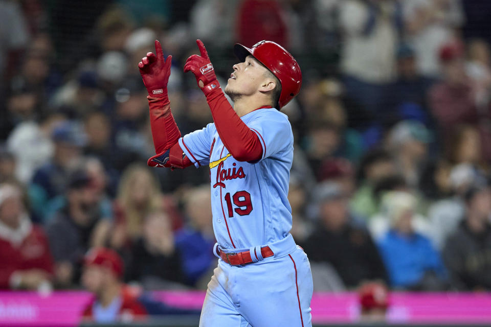 St. Louis Cardinals' Tommy Edman celebrates as he heads home after hitting a home run off Seattle Mariners relief pitcher Paul Sewald during the ninth inning of a baseball game Saturday, April 22, 2023, in Seattle. The Mariners won 5-4. (AP Photo/John Froschauer)