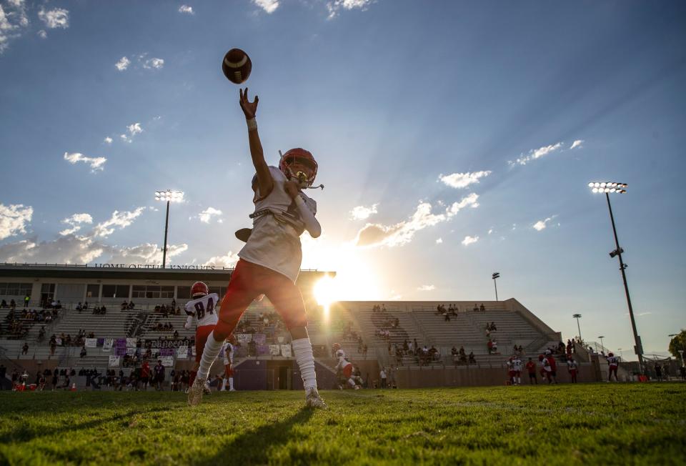 Indio's Elijah Gutierrez (5) gets a pass off during warmups before their game at Shadow Hills High School in Indio, Calif., Friday, Aug. 18, 2023.