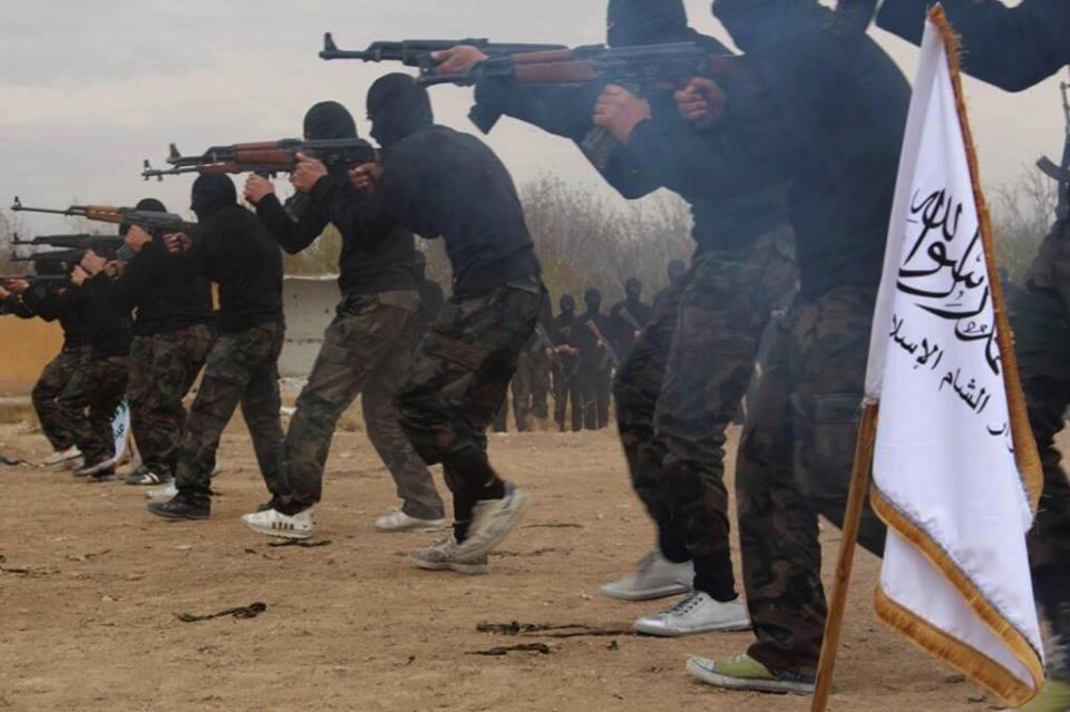 FILE - In this undated file picture released on Friday Nov. 29, 2013, and posted on the Facebook page of a militant group, members of Ahrar al-Sham brigade, one of the Syrian rebels groups, exercise in a train camp at unknown place in Syria. With a new label - the Islamic State of Iraq and the Levant - the global terror network al-Qaida is positioning itself as a vanguard defending a persecuted Sunni community against Shiite-dominated governments across Syria, Lebanon and Iraq. For moderates around the region, the renewed assertiveness of the jihadis is increasingly taking on the aspect of a regional calamity. (AP Photo, File