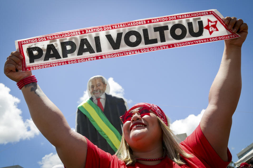 A supporter of Luiz Inacio Lula da Silva displays a sign reading in Portuguese ¨The Father Returned¨ prior to his inauguration as new president in Brasilia, Brazil, Sunday, Jan. 1, 2023. (AP Photo/Gustavo Moreno)