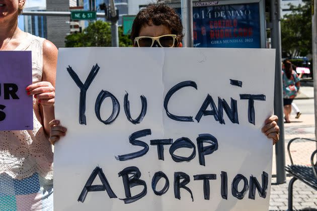 Pro-choice demonstrators hold placards in front of the Freedom Tower in Miami on May 3, 2022. (Photo: CHANDAN KHANNA via Getty Images)