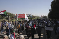 People protests against the October military coup and subsequent deal that reinstated Prime Minister Hamdok in Khartoum, Sudan, Monday, Dec. 6, 2021. (AP Photo/Marwan Ali)