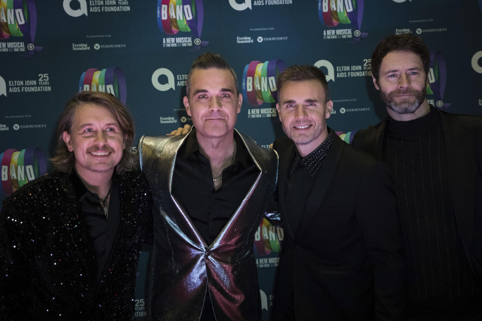 Take That band members, from left, Mark Owen, Robbie Williams, Gary Barlow and Howard Donald pose for photographers upon arrival at the premiere of the musical 'The Band', in London, Tuesday, Dec. 4, 2018. (Photo by Vianney Le Caer/Invision/AP)