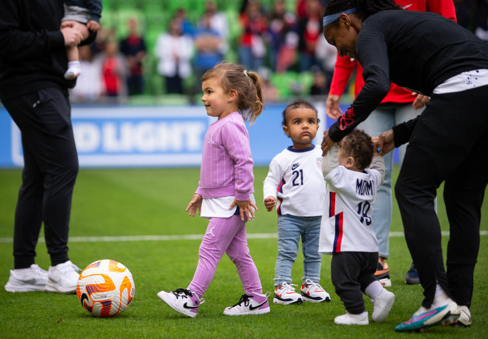 AUSTIN, TX - APRIL 8: The children of Alex Morgan #13, Crystal Dunn #19, and Adrianna Franch #21 of the United States play with the ball after an international friendly game between Ireland and USWNT at Q2 Stadium on April 8, 2023 in Austin, Texas. (Photo by Erin Chang/USSF/Getty Images).