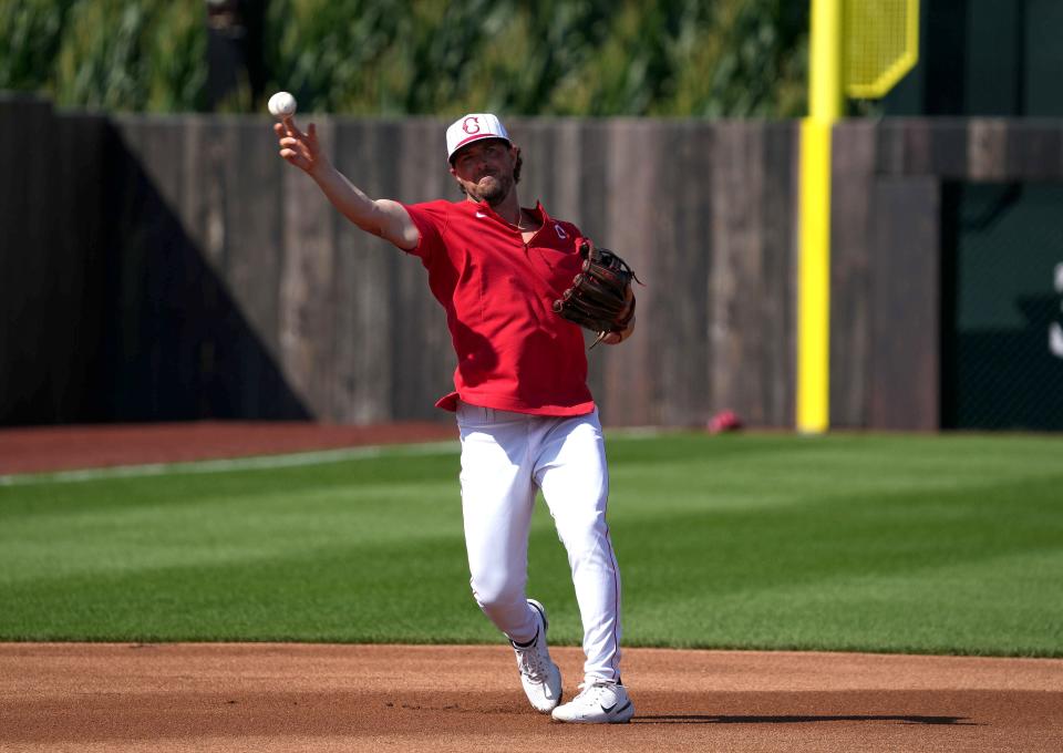 Cincinnati shortstop Kyle Farmer fields a ground ball during batting practice prior to Thursday's Major League Baseball game against the Chicago Cubs at the Field of Dreams in Dyersville.