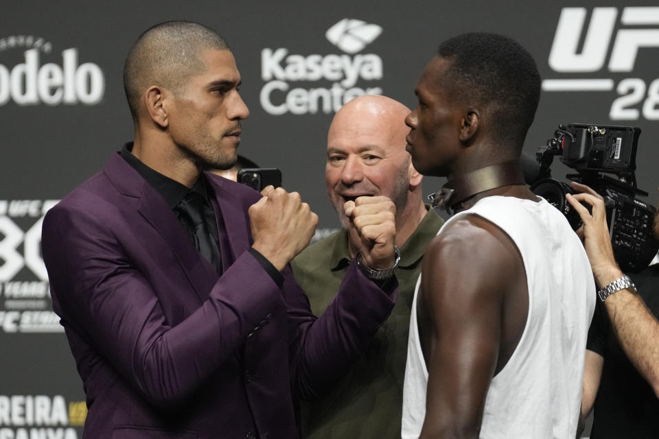 MIAMI, FLORIDA - APRIL 06: (L-R) Alex Pereira and Israel Adesanya face off for the press and the fans during a press conference for UFC 287, Pereira versus Adesanya 2, on April 6, 2023, at Kaseya Center in Miami, FL. (Photo by Louis Grasse/PxImages/Icon Sportswire via Getty Images)