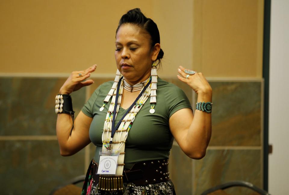 Carisa Yazzie-Gonzalez participates in the tai chi class on June 30 during the Celebration of Women Conference hosted by Sisters in Circle at the Farmington Civic Center.