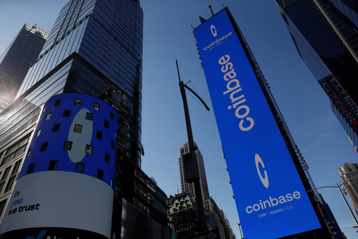 The logo for Coinbase Global Inc, the biggest U.S. cryptocurrency exchange, is displayed on the Nasdaq MarketSite jumbotron and others at Times Square in New York, U.S., April 14, 2021. REUTERS/Shannon Stapleton