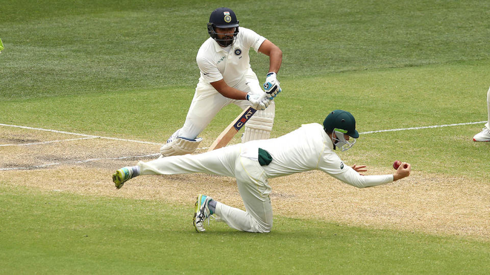 Peter Handscomb takes a great catch to dismiss Rohit Sharma. (Photo by Ryan Pierse/Getty Images)