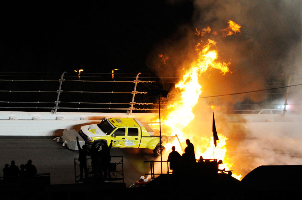 DAYTONA BEACH, FL - FEBRUARY 27: Safety workers try to extinguish a fire from a jet dryer after being hit by Juan Pablo Montoya, driver of the #42 Target Chevrolet, under caution during the NASCAR Sprint Cup Series Daytona 500 at Daytona International Speedway on February 27, 2012 in Daytona Beach, Florida. (Photo by John Harrelson/Getty Images for NASCAR)