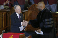 Democratic Presidential candidate Michael Bloomberg, left, greets the Rev. Robert Turner, right, during a service at the Vernon American Methodist Episcopal Church in Tulsa, Okla., Sunday, Jan. 19, 2020. (AP Photo/Sue Ogrocki)