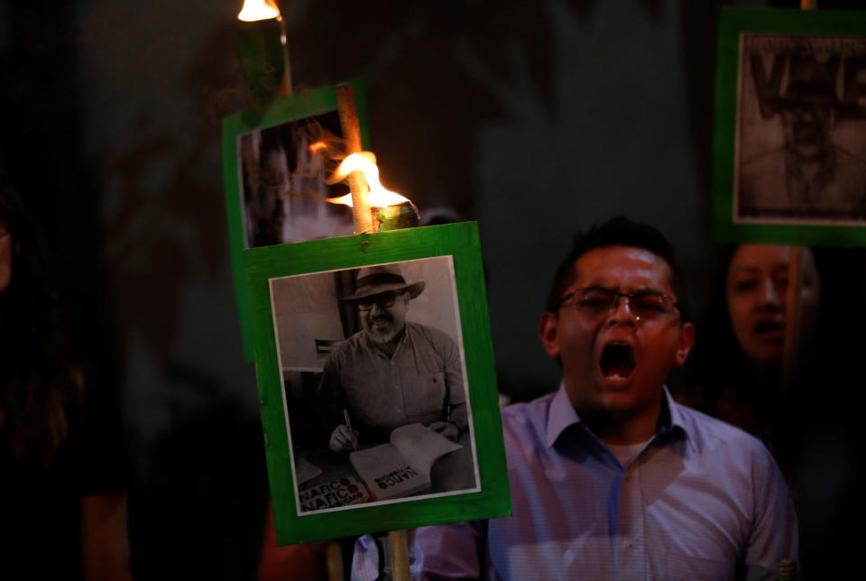 Demonstrators in Mexico City earlier this year held up pictures of journalist Javier Valdez Cardenas to call attention to his killing and the slayings of other journalists in Mexico. (Photo: Henry Romero / Reuters)