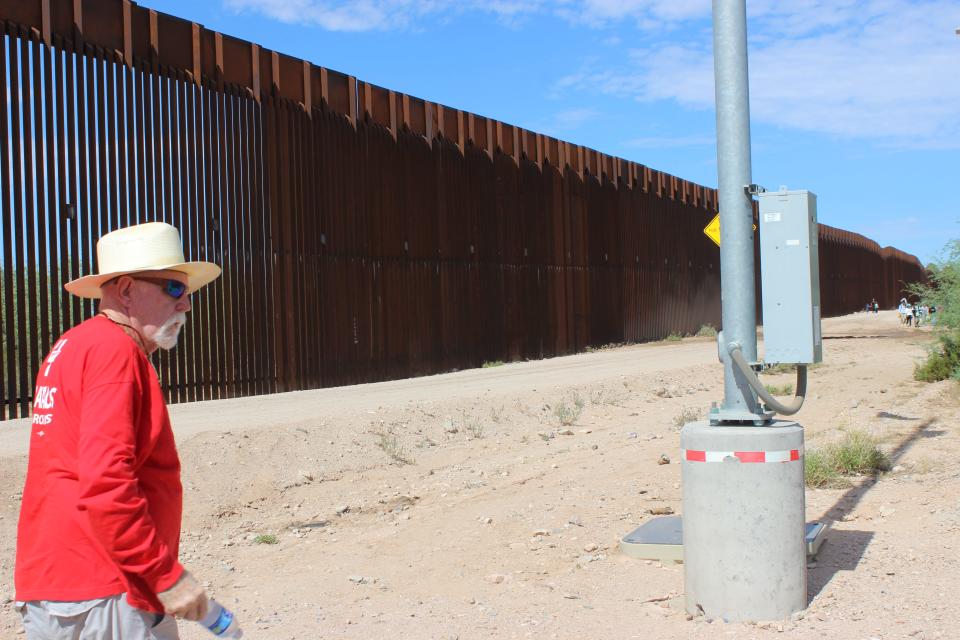 Tom Wingo, 76, refills water drums and gives water to migrants on the Organ Pipe Cactus National Monument west of Lukeville on Tuesday, August 22, 2023.