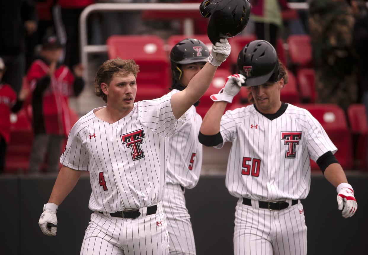 Texas Tech catcher Kevin Bazzell (4) gestures to the bullpen after hitting a home run against Brigham Young in a March 23 game at Dan Law Field/Rip Griffin Park. Bazzell is a consensus top-100 prospect for the Major League Baseball draft that begins Sunday.